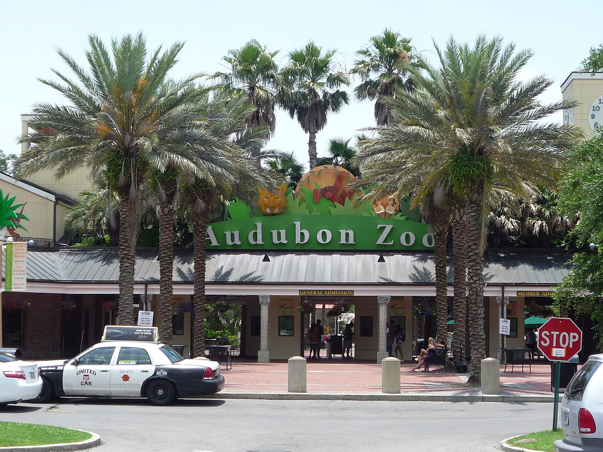 The Audubon Zoo entrance sign framed by palms in Uptown New Orleans