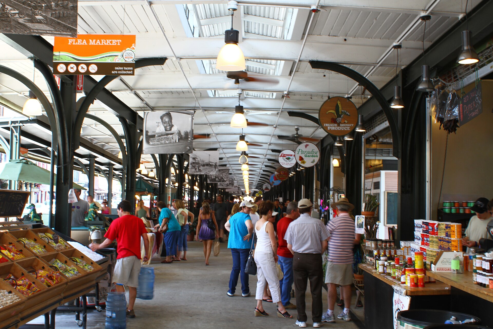 Shoppers browsing covered stalls at the French Market in New Orleans