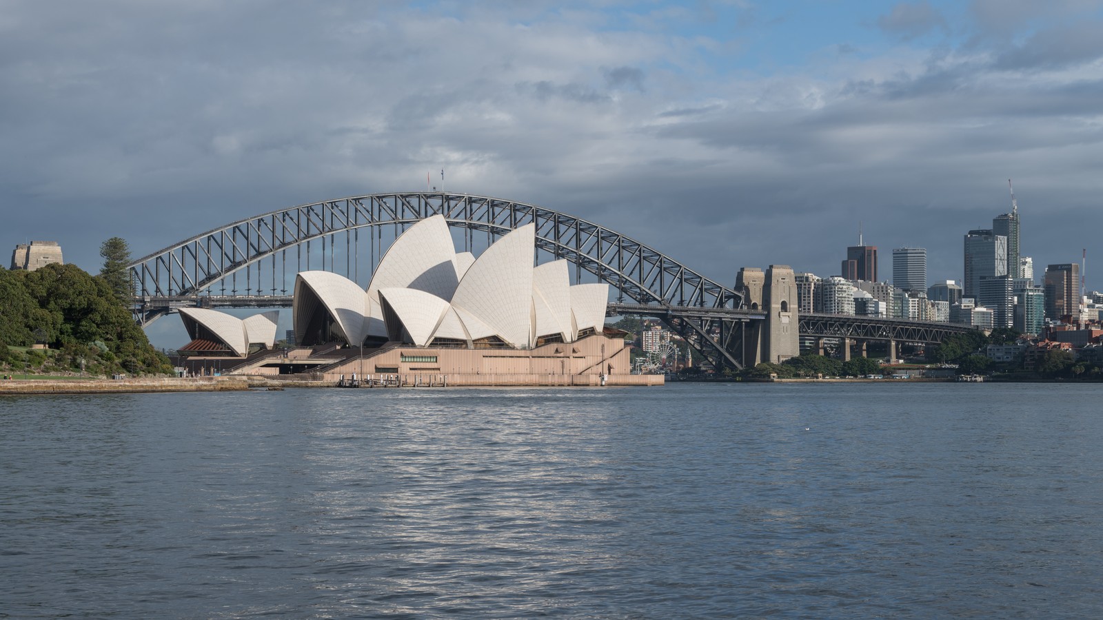 Sydney Opera House and Sydney Harbour Bridge seen across the harbor.