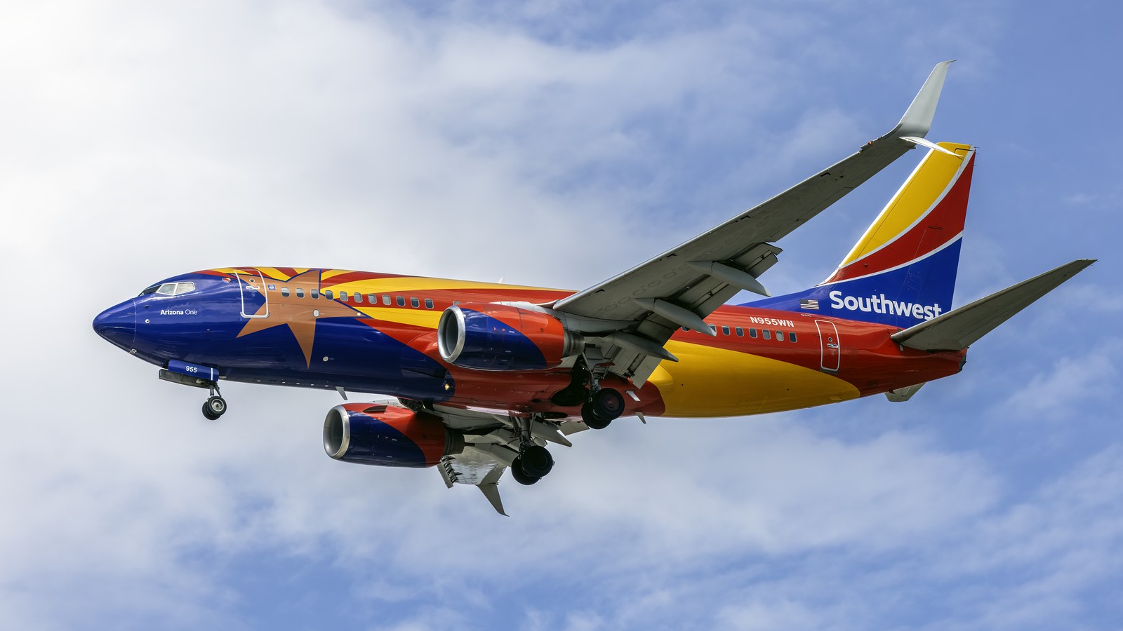 Southwest Airlines Boeing 737-700 N955WN in flight against a clear sky
