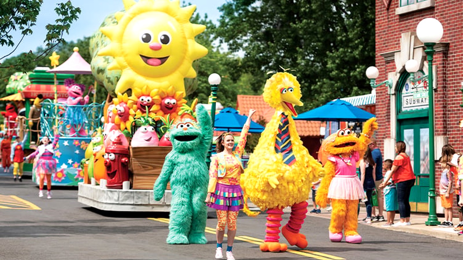Sesame Street Party Parade performers and floats at Sesame Place San Diego under bright daylight