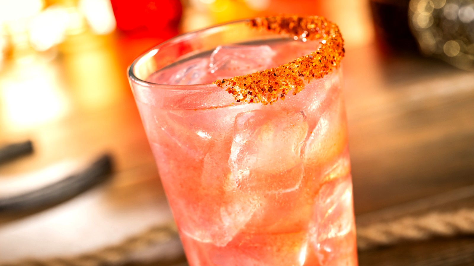 Enchanting Ember Lemonade drink in a glass with chili-lime rim at Magic Kingdom Diamond Horseshoe preview