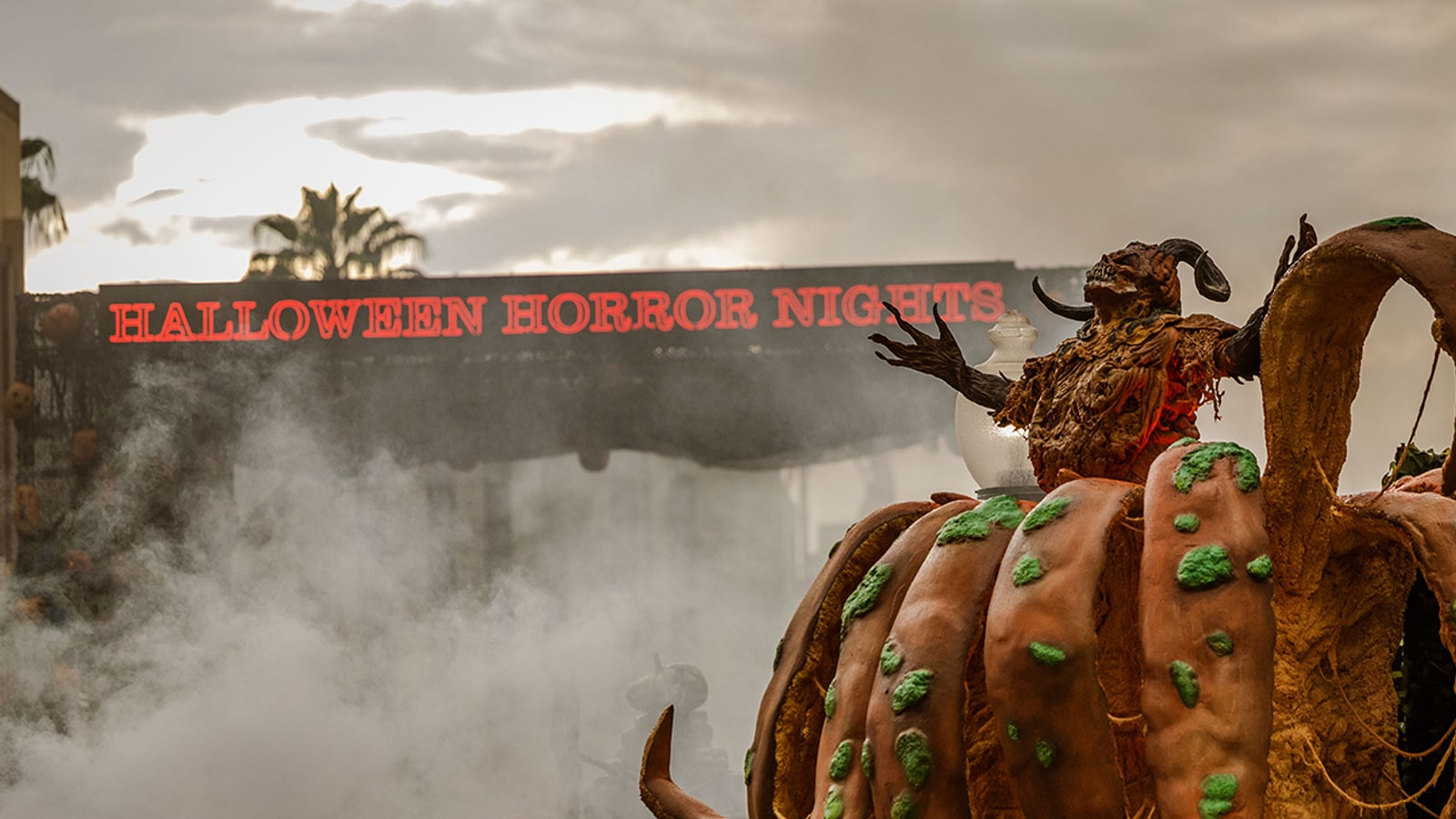 Halloween Horror Nights entrance sign and pumpkin creature at Universal Studios Florida