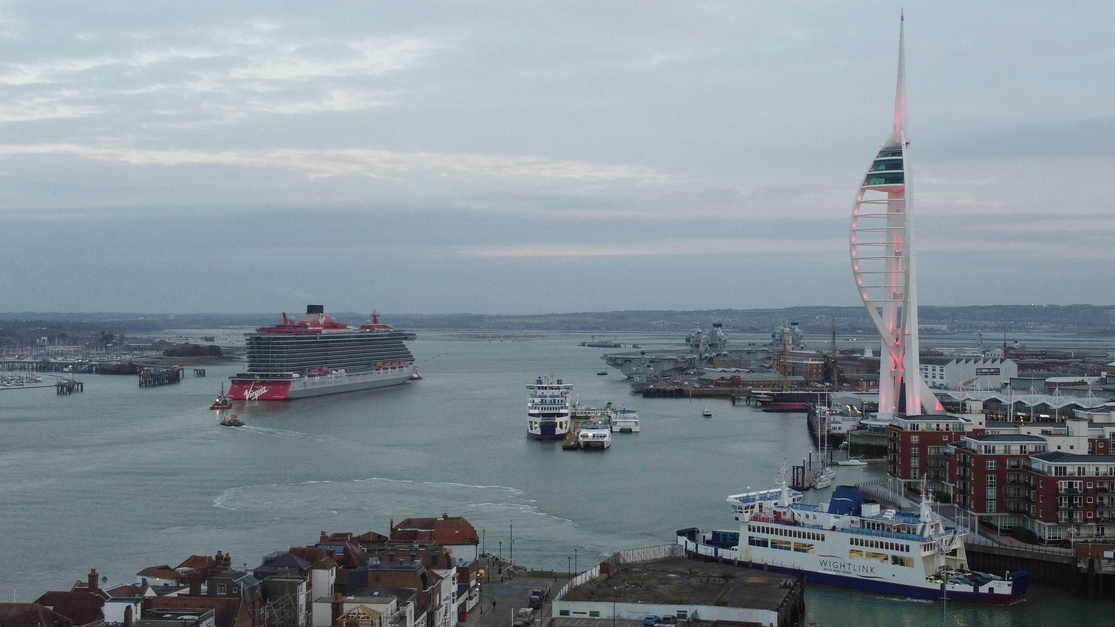 Virgin Voyages Valiant Lady cruise ship arriving at Portsmouth with bow lettering and Lady-class hull clearly visible