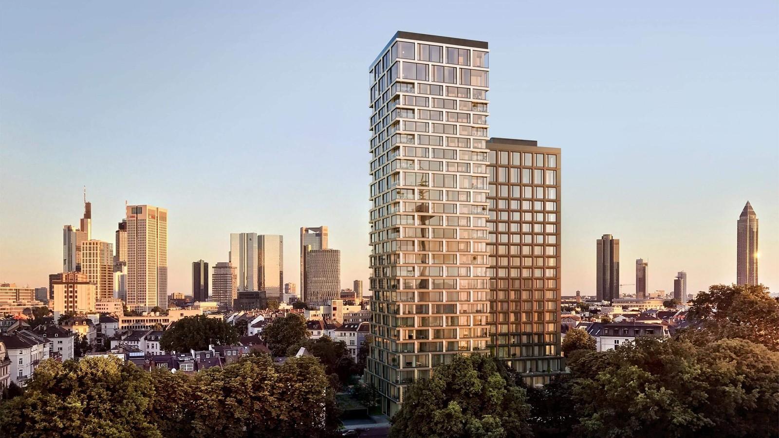 Roomers ParkView hotel tower in Frankfurt Westend with Grüneburgpark trees in the foreground and the city skyline beyond
