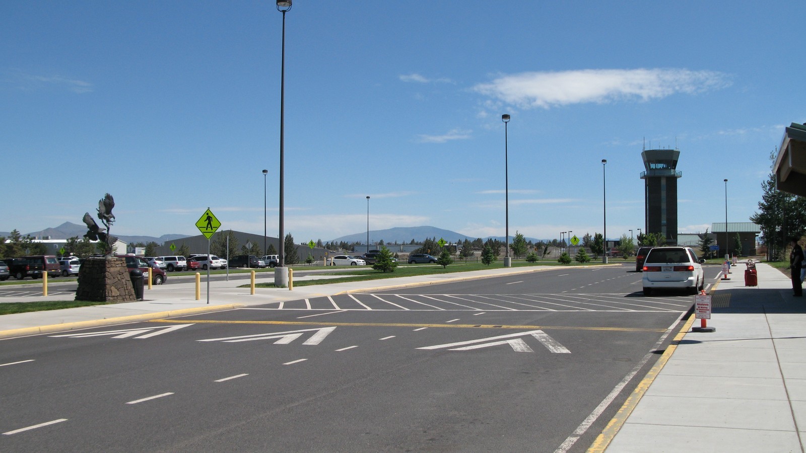 Daytime curb and control tower at Redmond Municipal Airport in Central Oregon