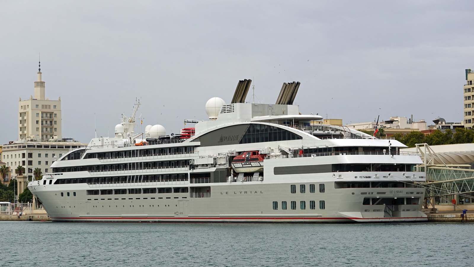 Ponant expedition ship Le Lyrial at berth with hull name and PONANT branding visible