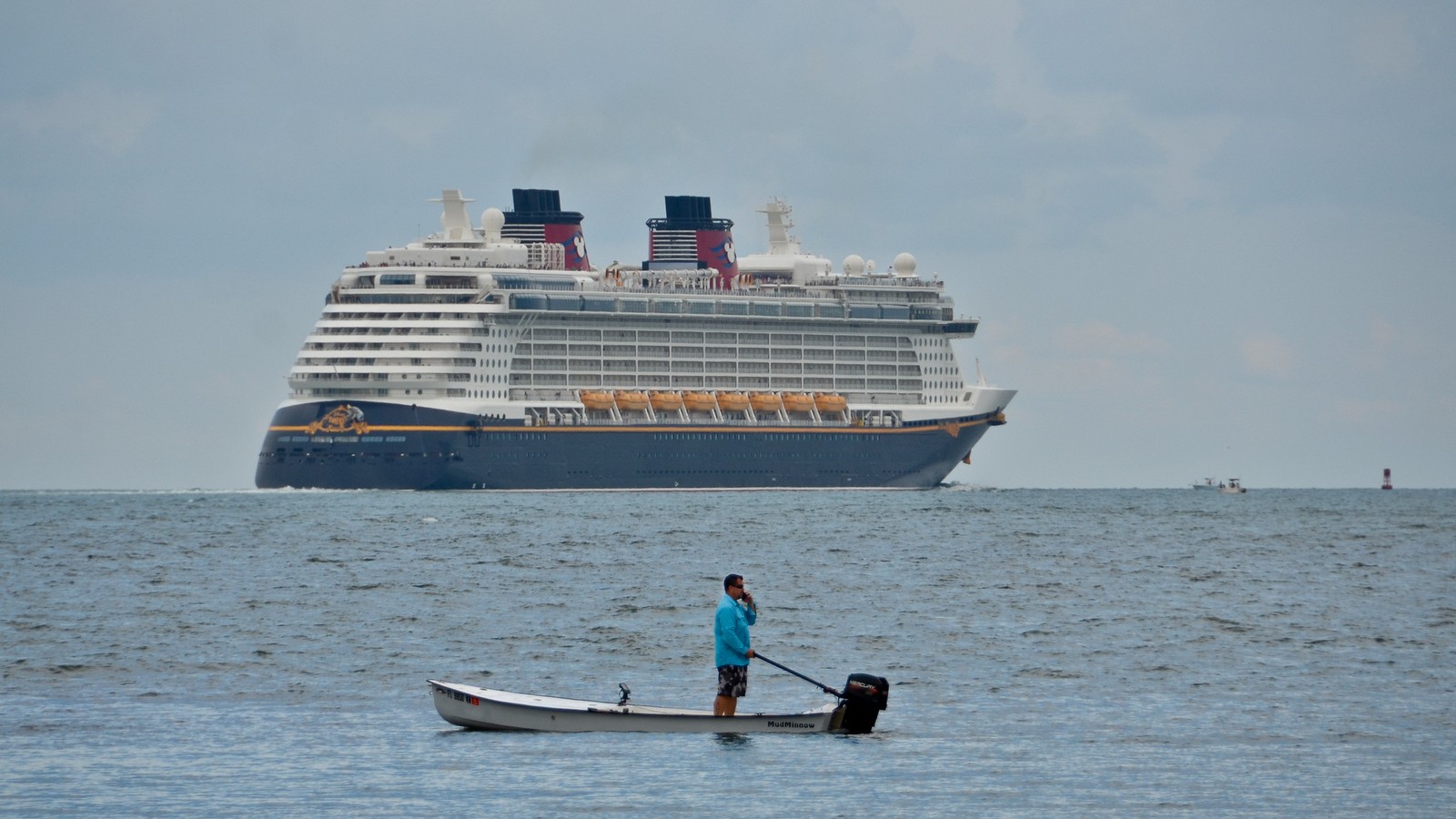 Disney Fantasy cruise ship exterior at sea under bright daylight, representing the Disney Cruise Line fleet for fleetwide Lorcana expansion