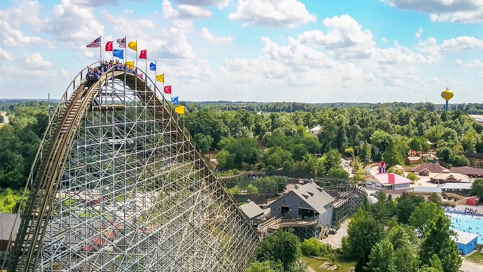 Aerial daylight view of The Voyage wooden coaster and Holiday World water tower in Santa Claus Indiana