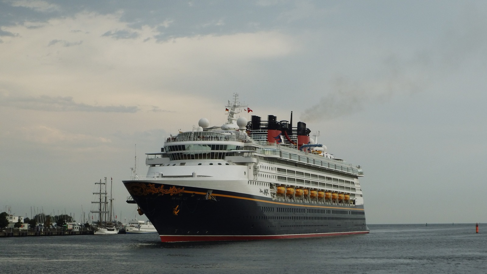 Disney Magic cruise ship entering the port of Warnemunde under daylight