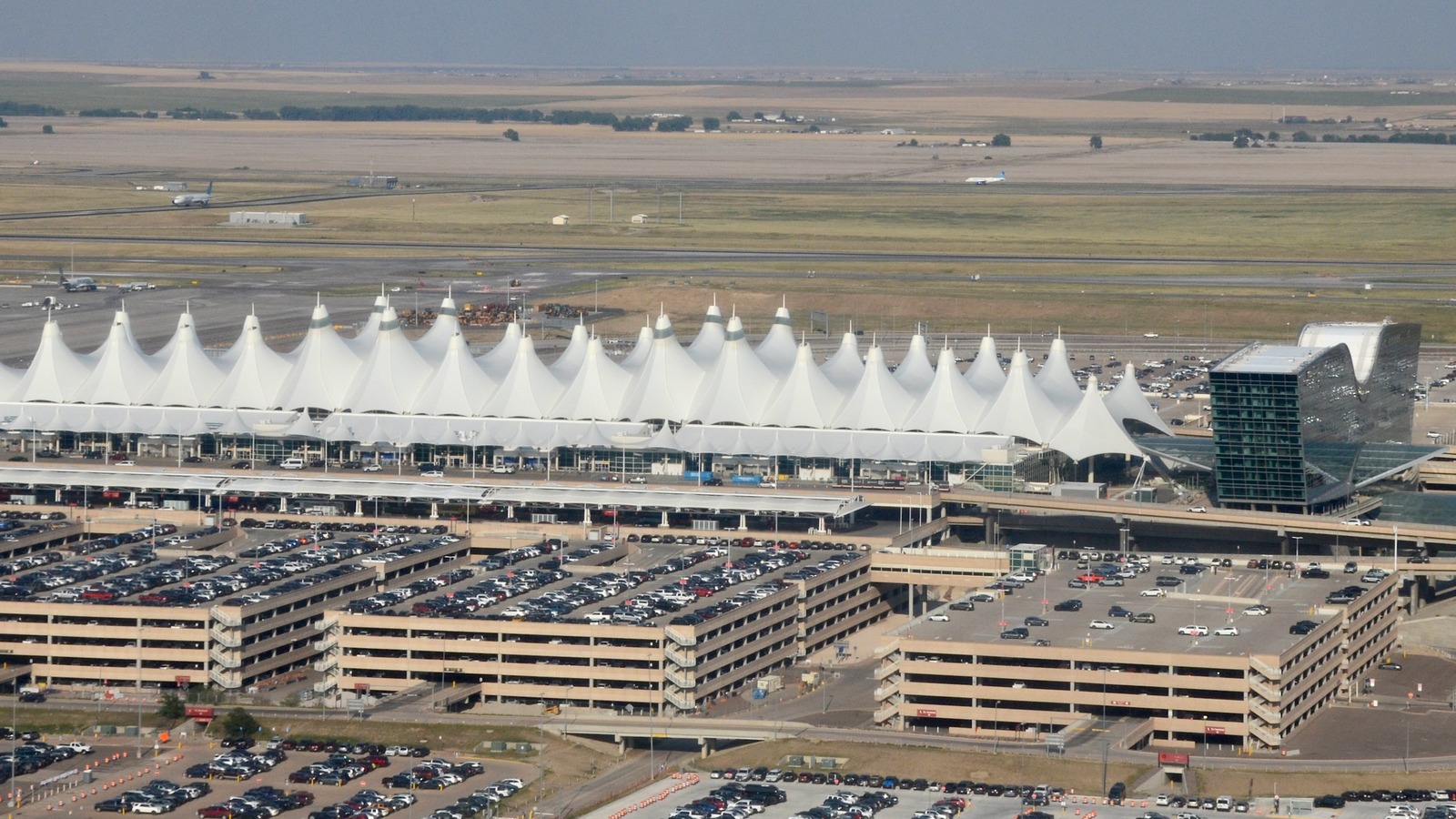 Aerial view of the white peaked Jeppesen Terminal roof at Denver International Airport