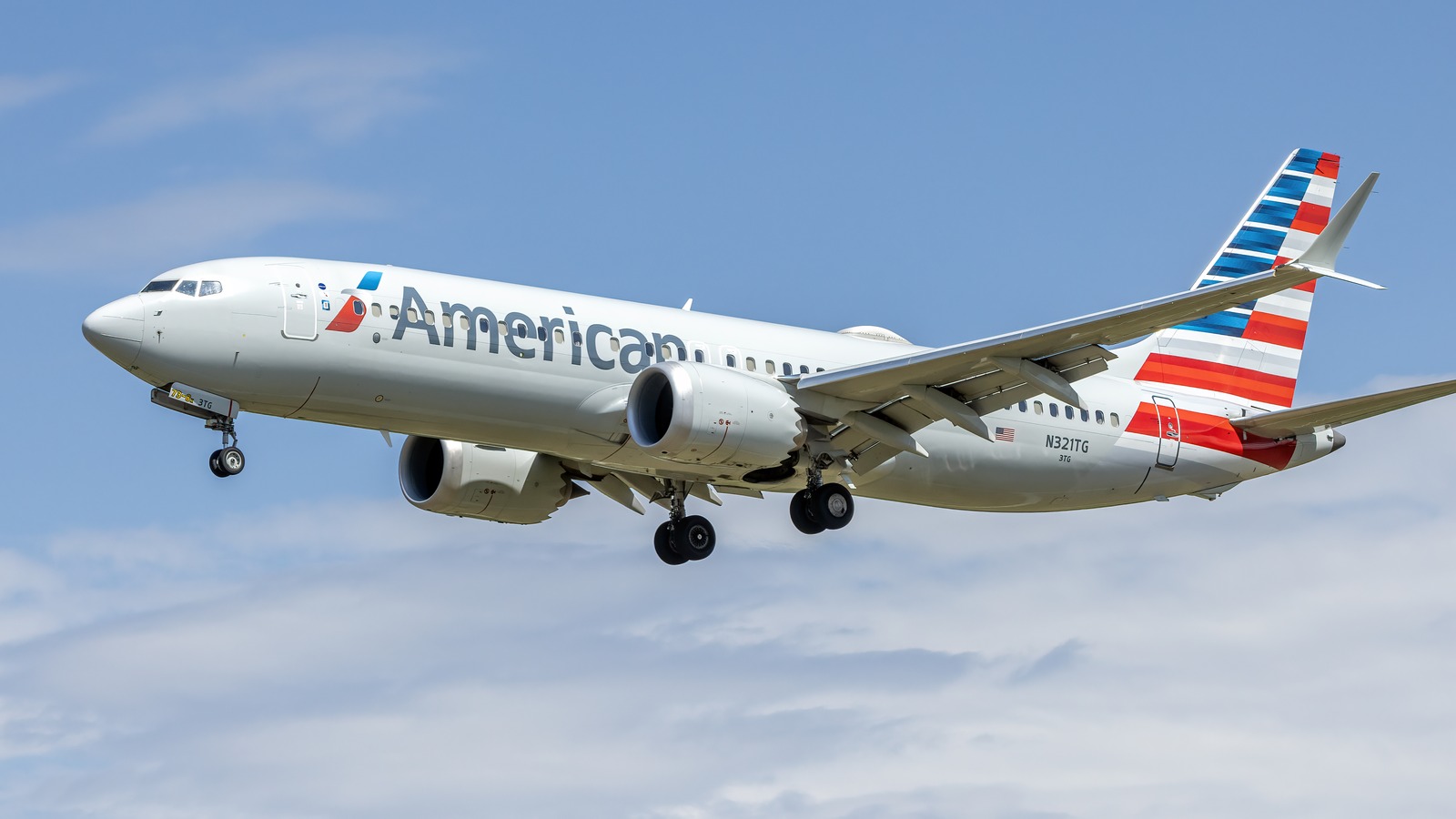American Airlines Boeing 737-8 MAX in current American livery against a blue sky