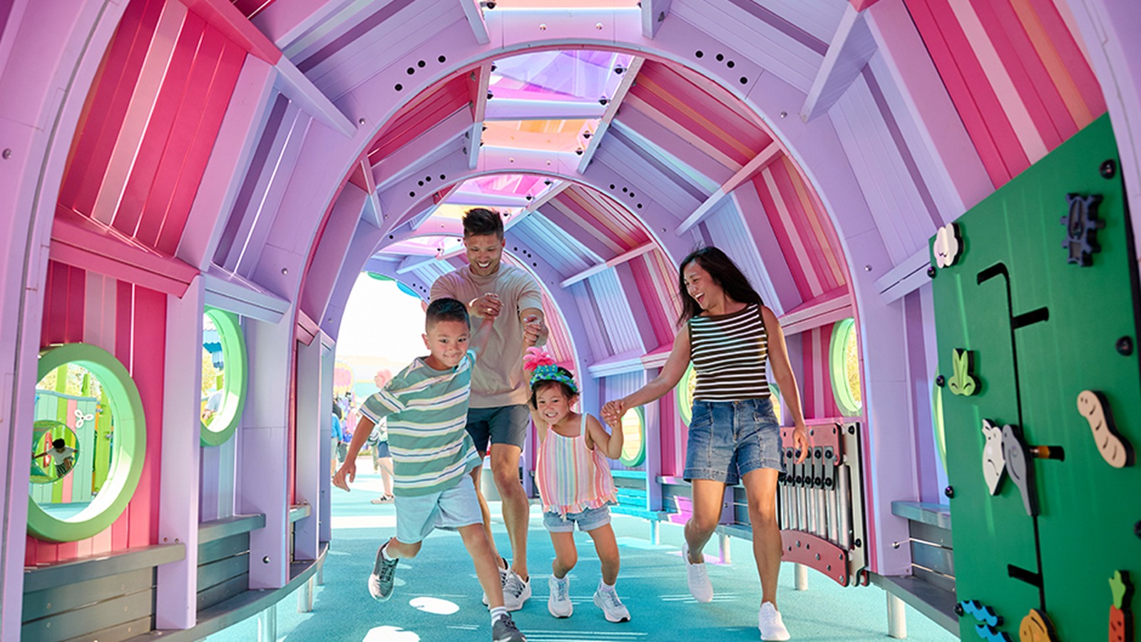 Family exploring a colorful play area at Universal Kids Resort in Frisco