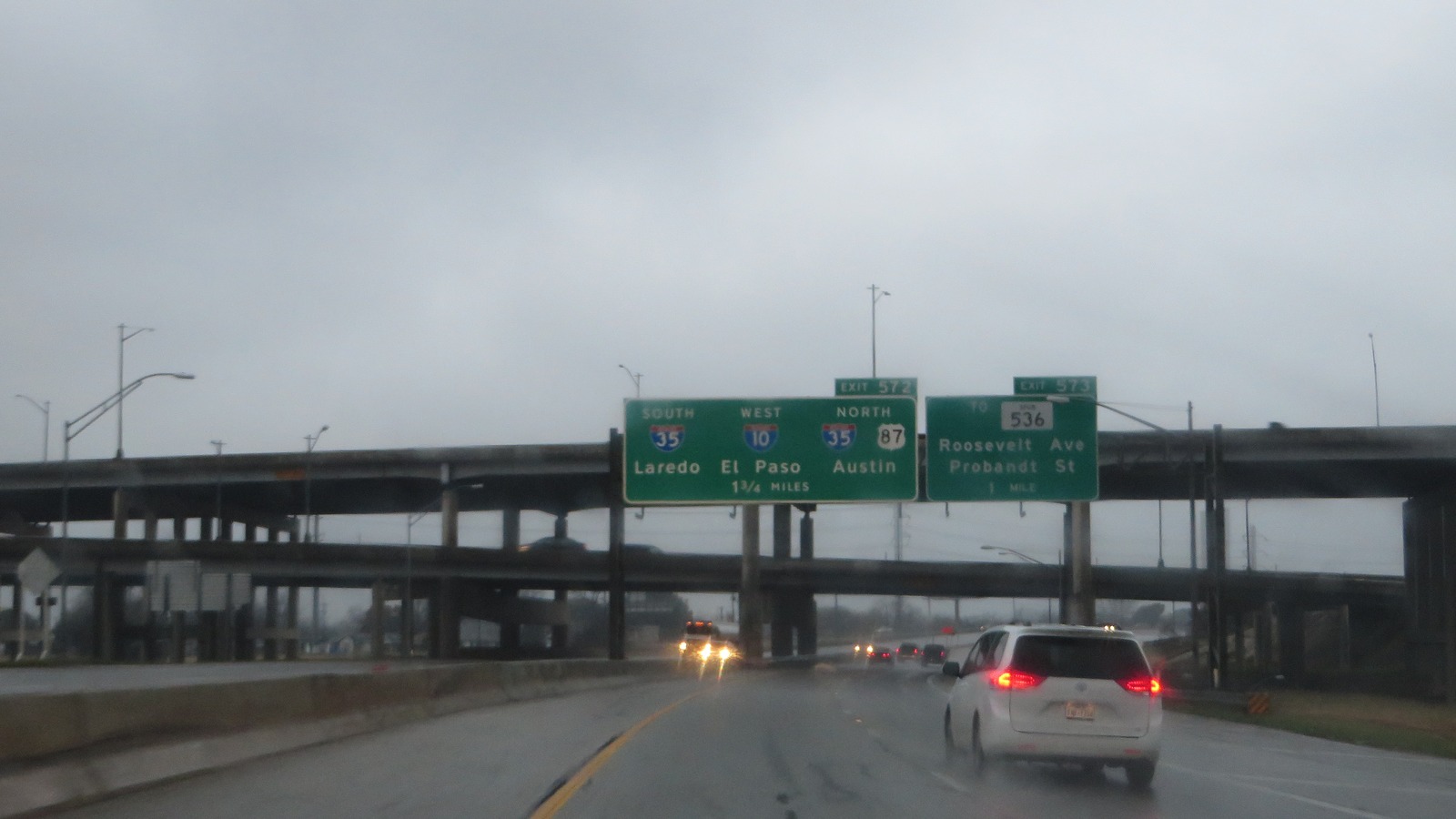 Interstate 35 approaching the Interstate 10 junction in San Antonio, Texas, with freeway signs and mainlanes visible