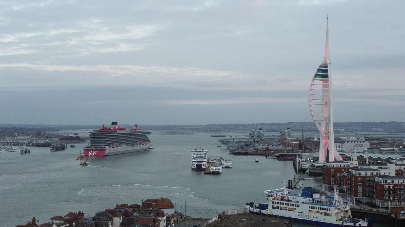 Virgin Voyages Valiant Lady cruise ship arriving at Portsmouth with bow lettering visible
