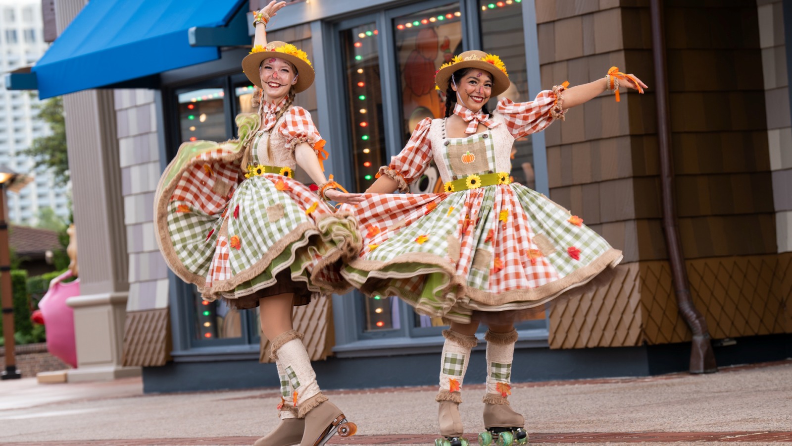Harvest Skaters in fall costumes roller skating through Disney Springs Town Center seasonal entertainment