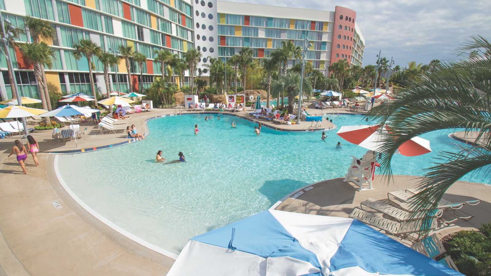 Daylight view of the pool and colorful towers at Universal Cabana Bay Beach Resort in Orlando