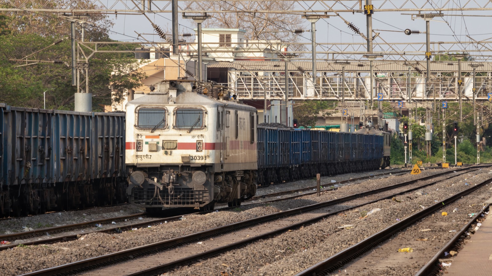 Indian Railways WAP-7 electric locomotive and passenger coaches at Eluru railway station platform