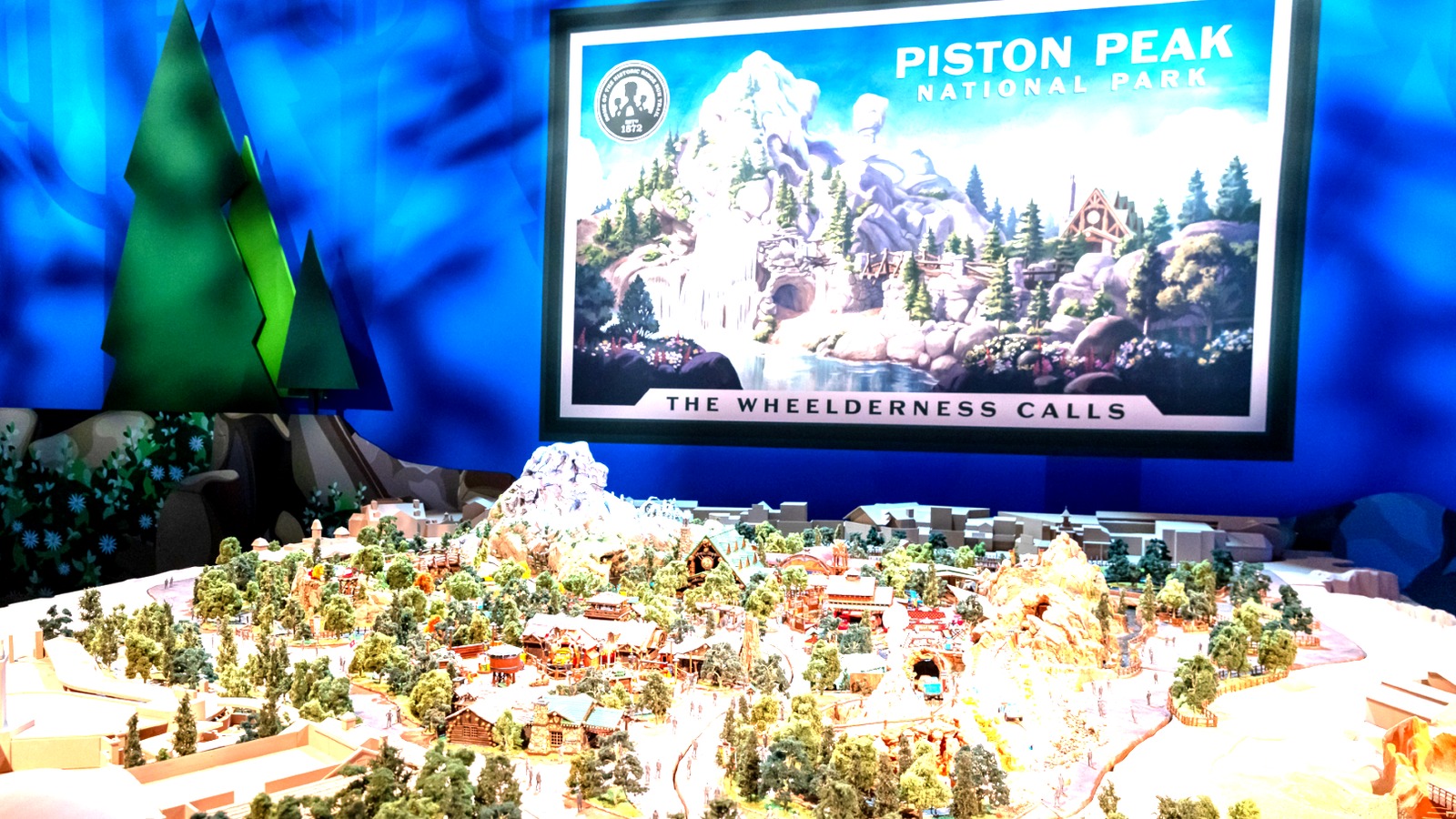 Piston Peak National Park scale model and poster inside the Imagineering Horizons pavilion at D23 2026