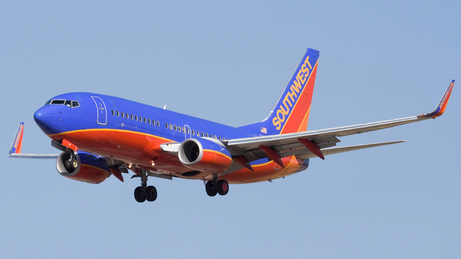Southwest Airlines Boeing 737 in blue and red livery climbing after takeoff