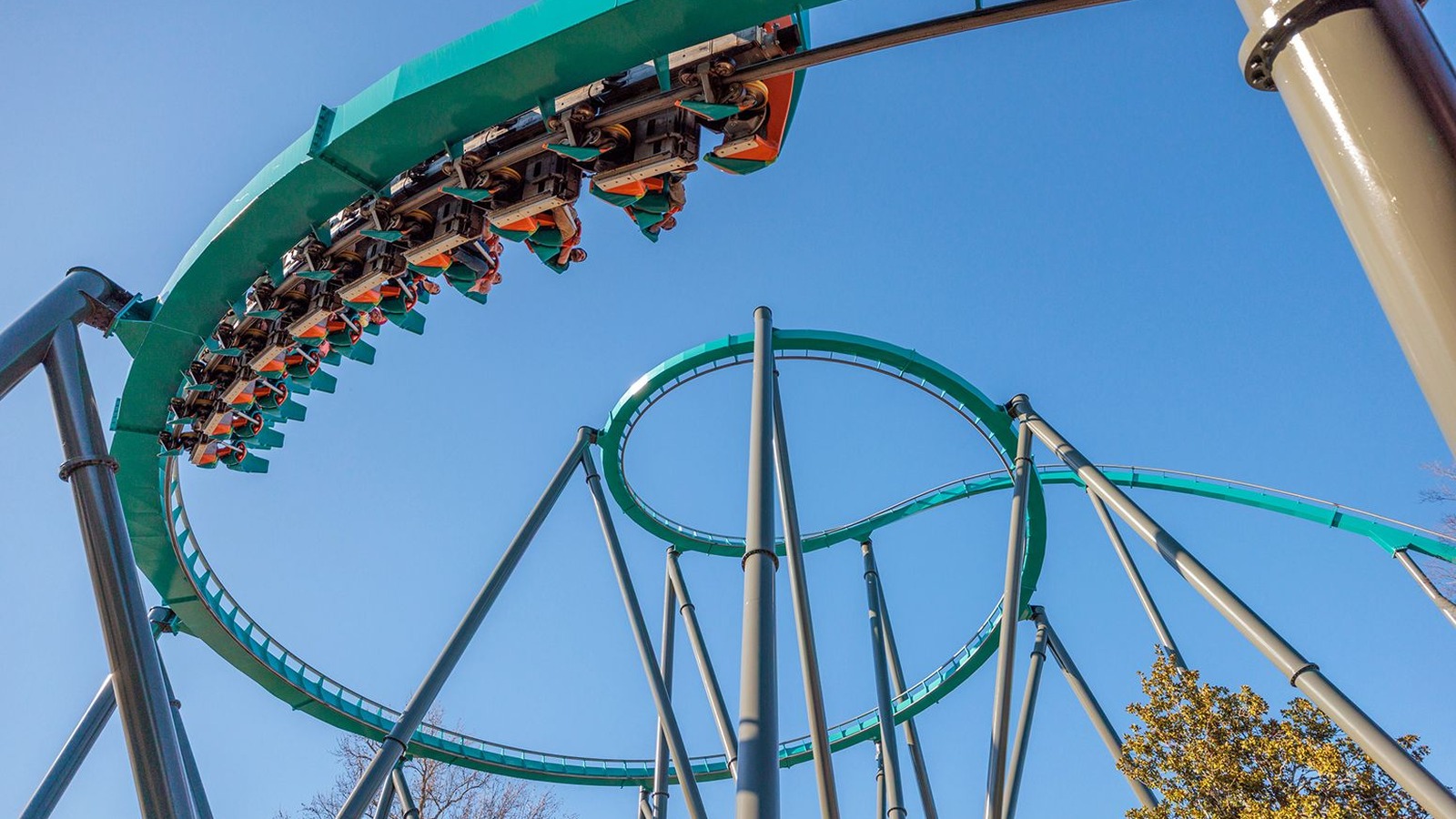 Georgia Scorcher teal looping coaster at Six Flags Over Georgia in daylight