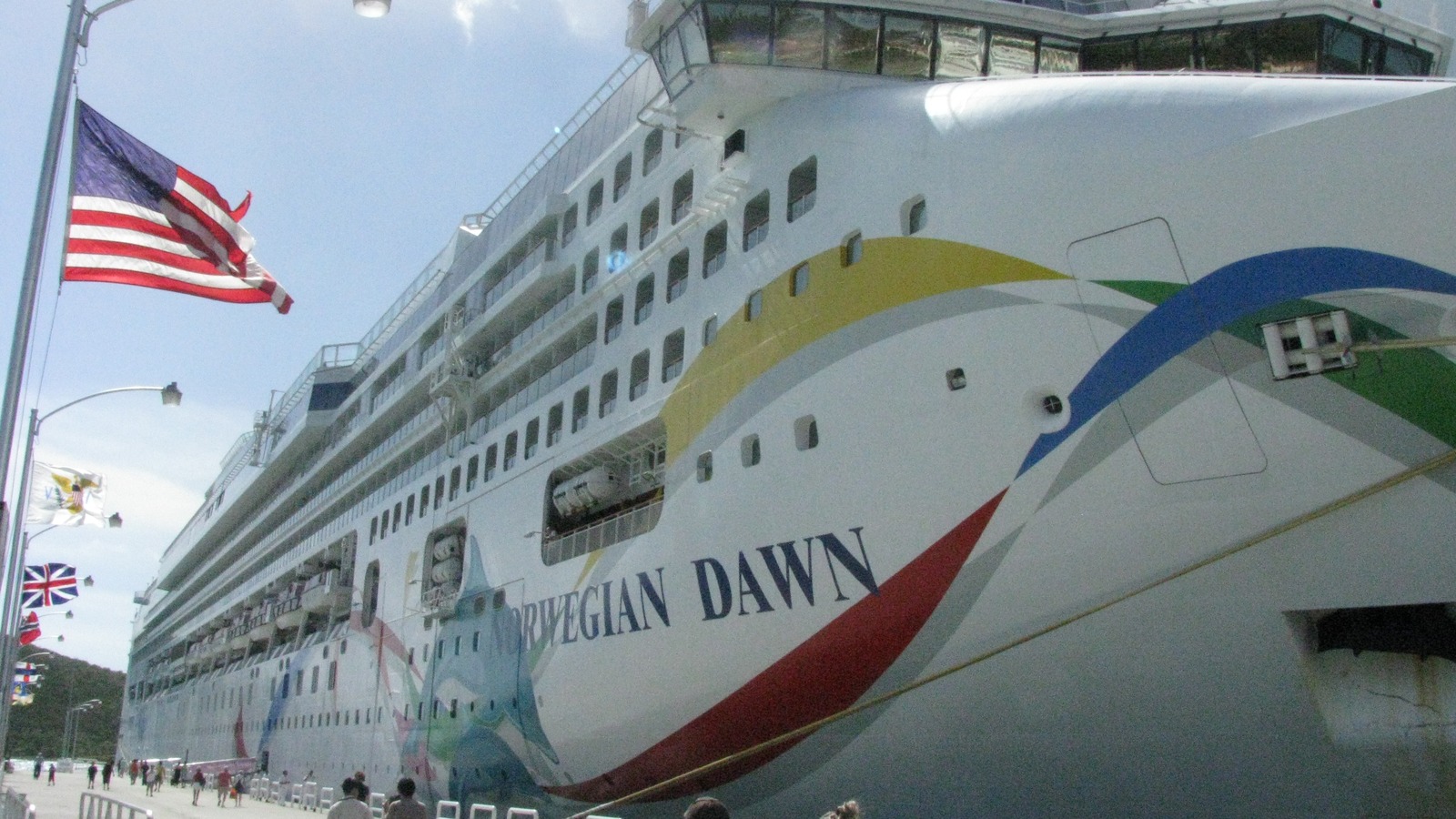 Norwegian Dawn cruise ship docked in Saint Thomas with blue hull art and Norwegian funnel mark