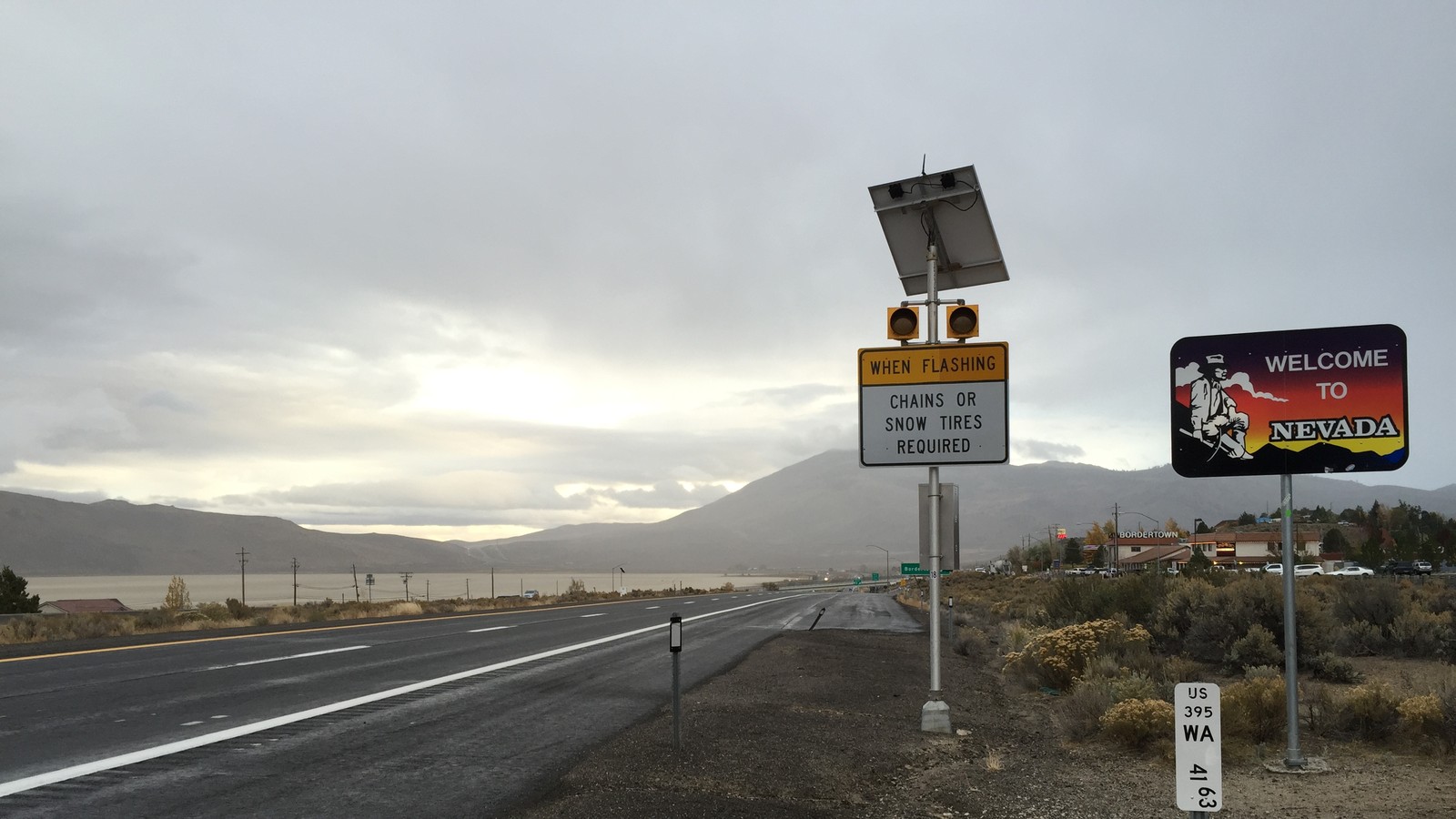 US 395 at the California to Nevada line with a Welcome to Nevada sign and a US 395 milepost