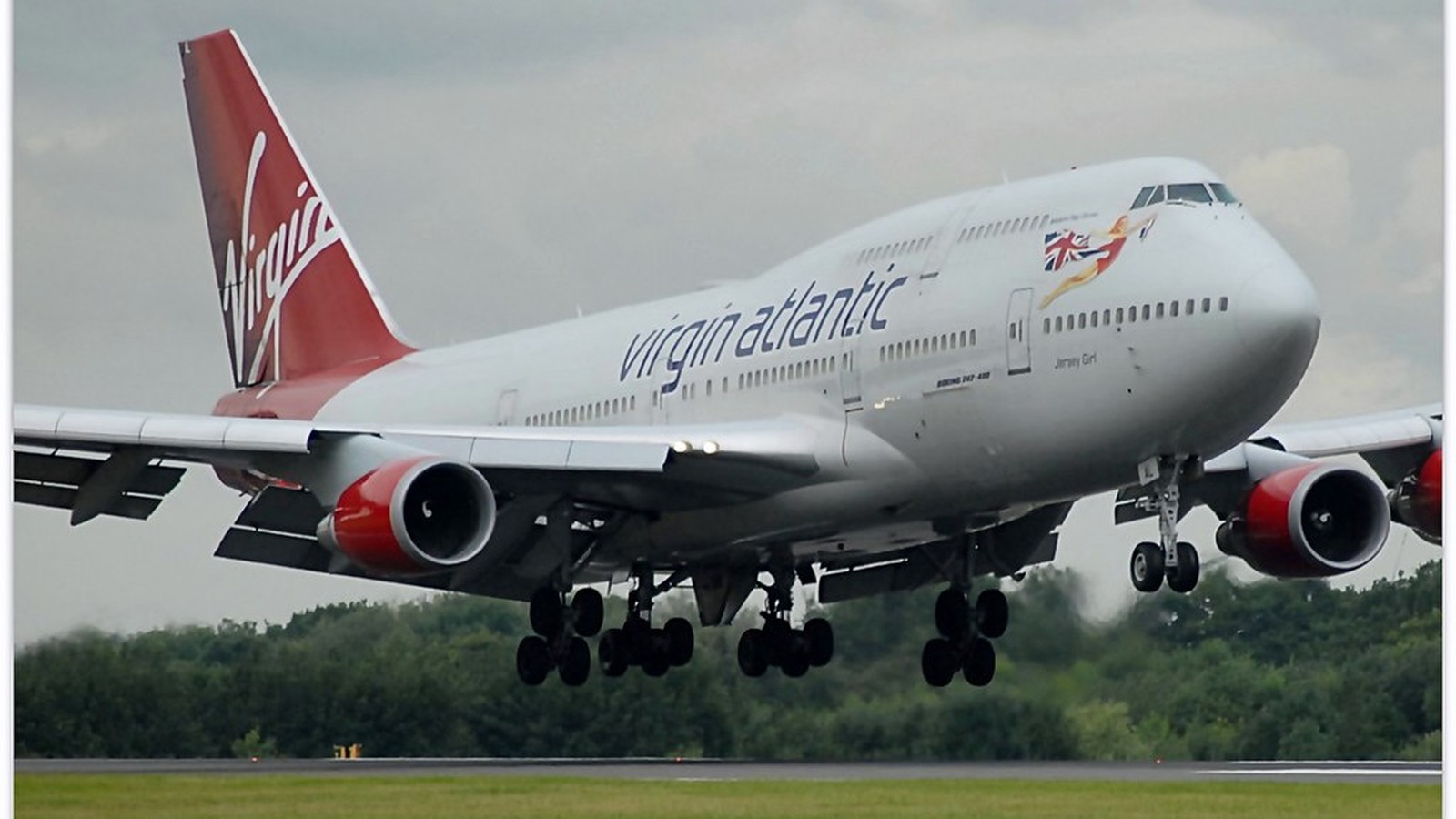 Virgin Atlantic aircraft on the apron at an airport gate area