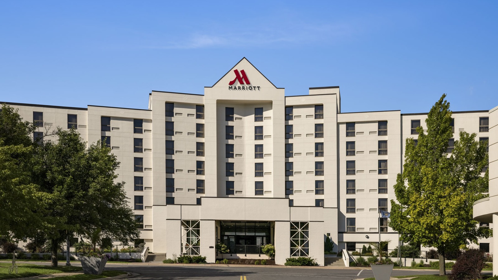 Daytime exterior of Madison Marriott South with red Marriott logo above the main entrance on John Nolen Drive