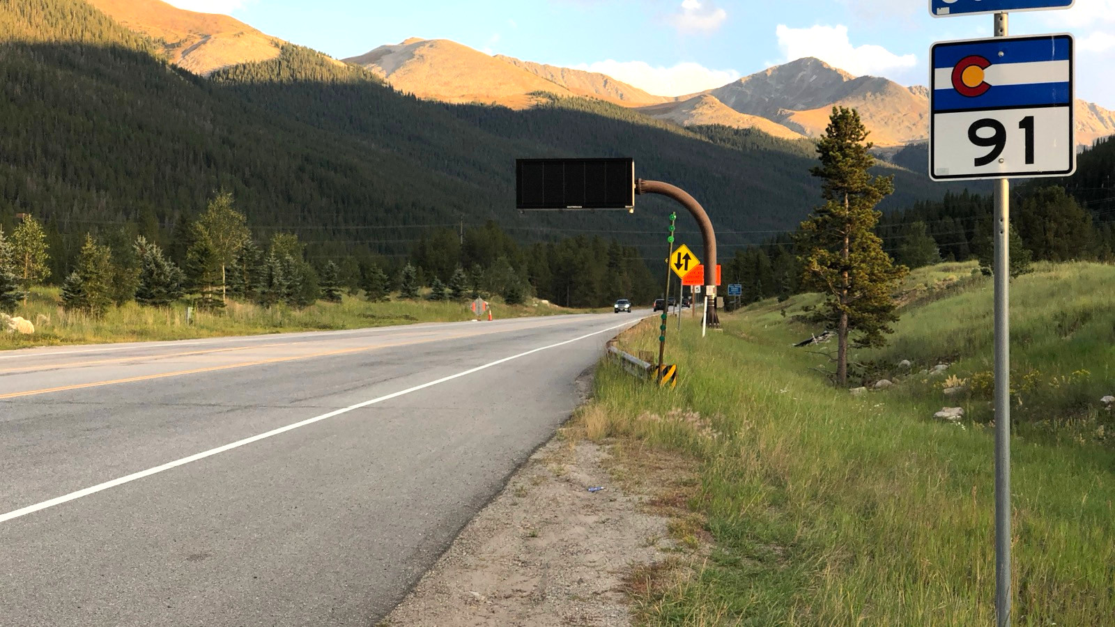 Colorado Route 91 entering Copper Mountain with the mountain range beyond