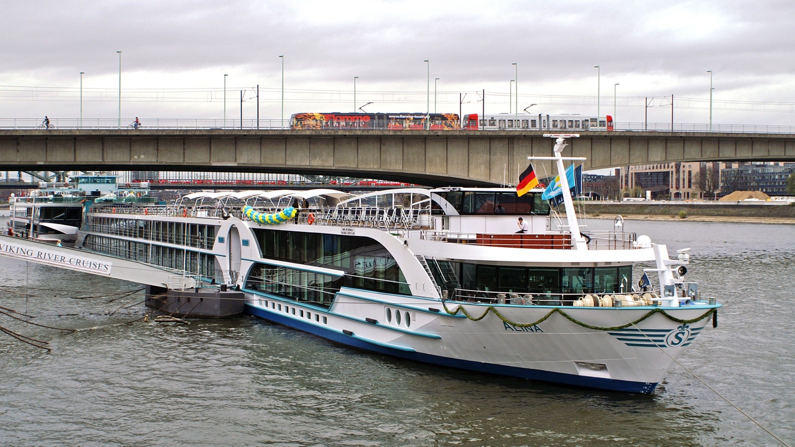 Phoenix Reisen charter river cruise ship Alina on a European waterway under clear sky