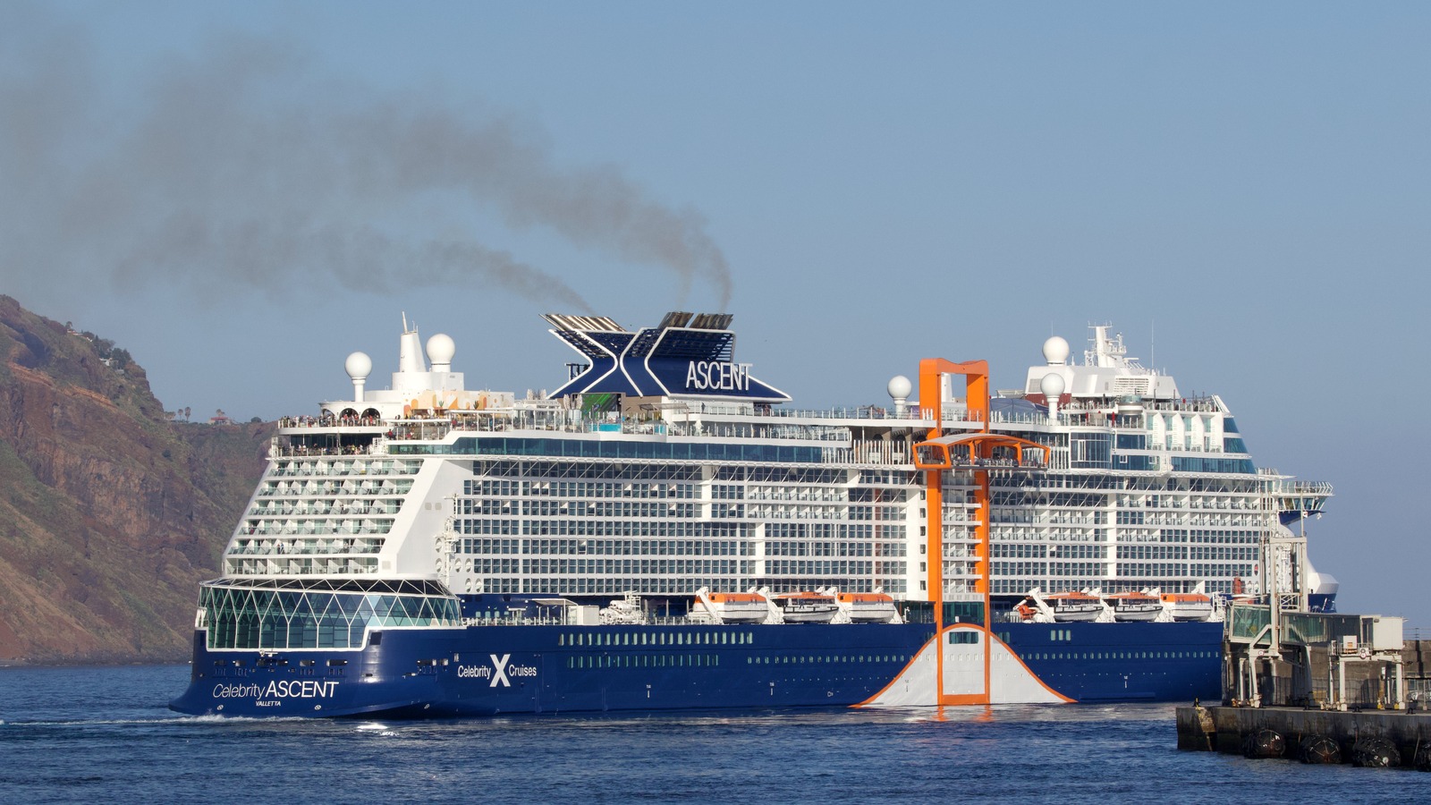 Daylight port-side view of Celebrity Ascent with readable Celebrity ASCENT hull name, Celebrity X Cruises mark, and ASCENT funnel