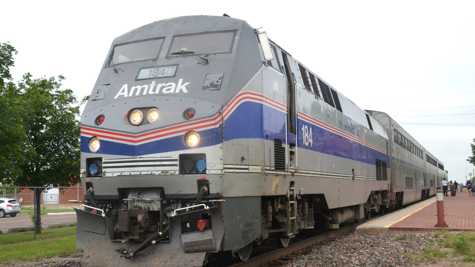Amtrak Heartland Flyer train led by locomotive 184 at Norman Oklahoma in daylight