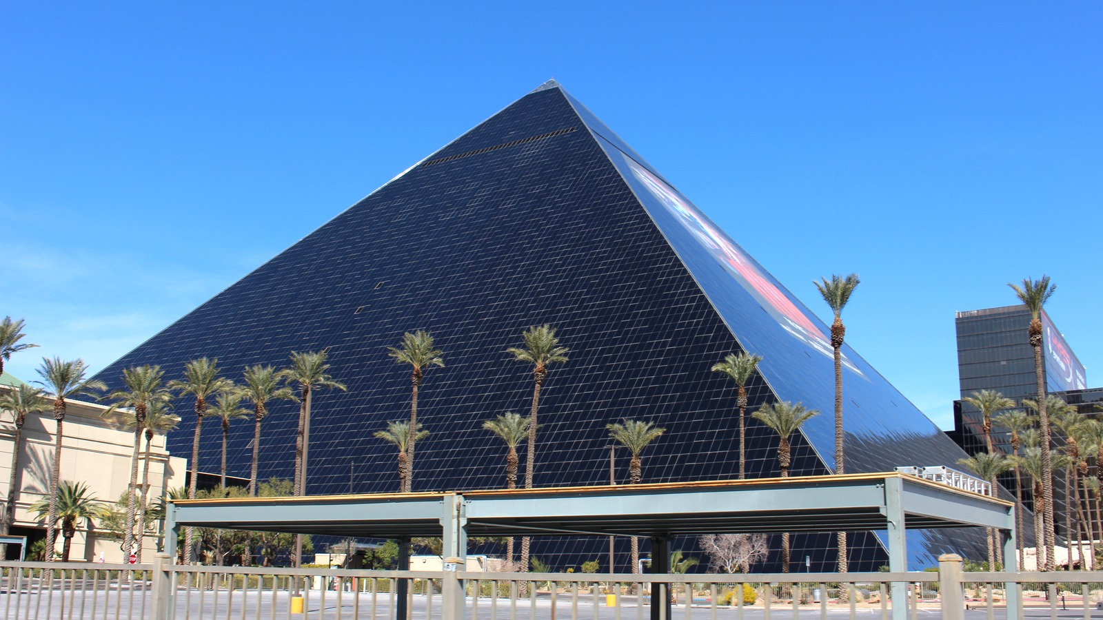 Luxor Las Vegas black glass pyramid and Sphinx on the Strip in daylight