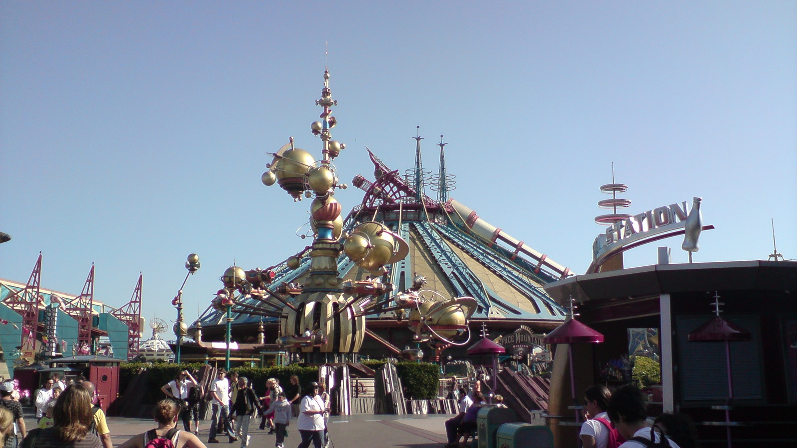 Disneyland Paris Space Mountain exterior with Mission 2 signage in Discoveryland under a clear sky
