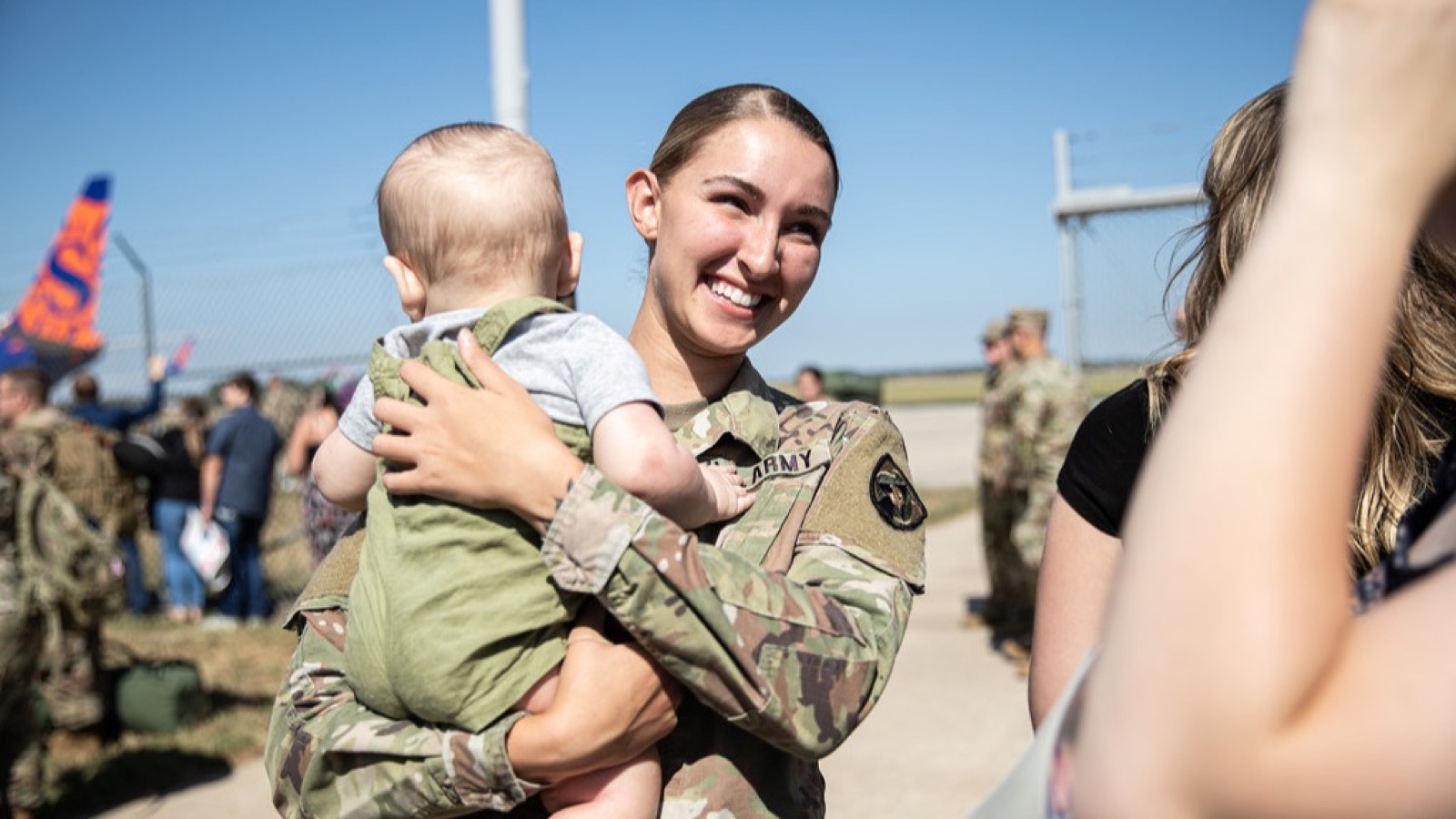 A military family reunion on the apron at Waterloo Regional Airport in Iowa, before the September 2026 closure