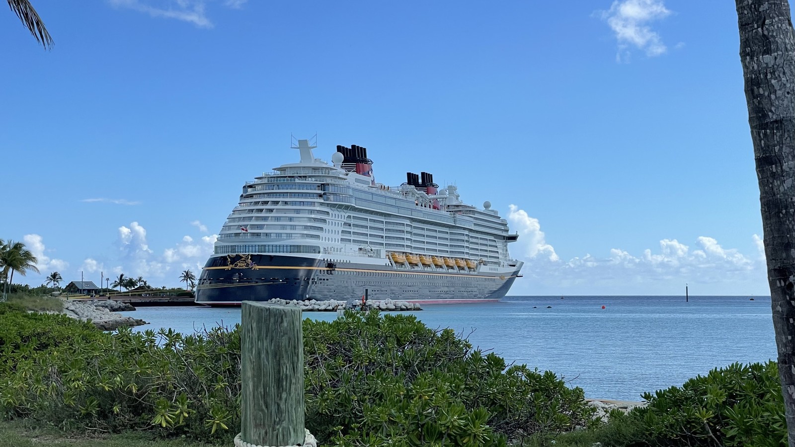 Disney Wish cruise ship at Castaway Cay on a clear day