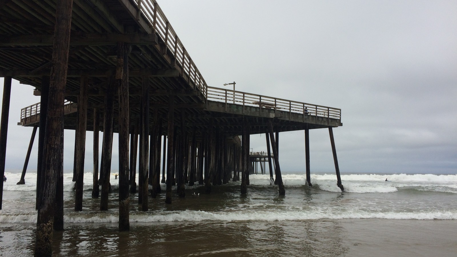 Pismo Beach shoreline and coastal buildings under bright California sky
