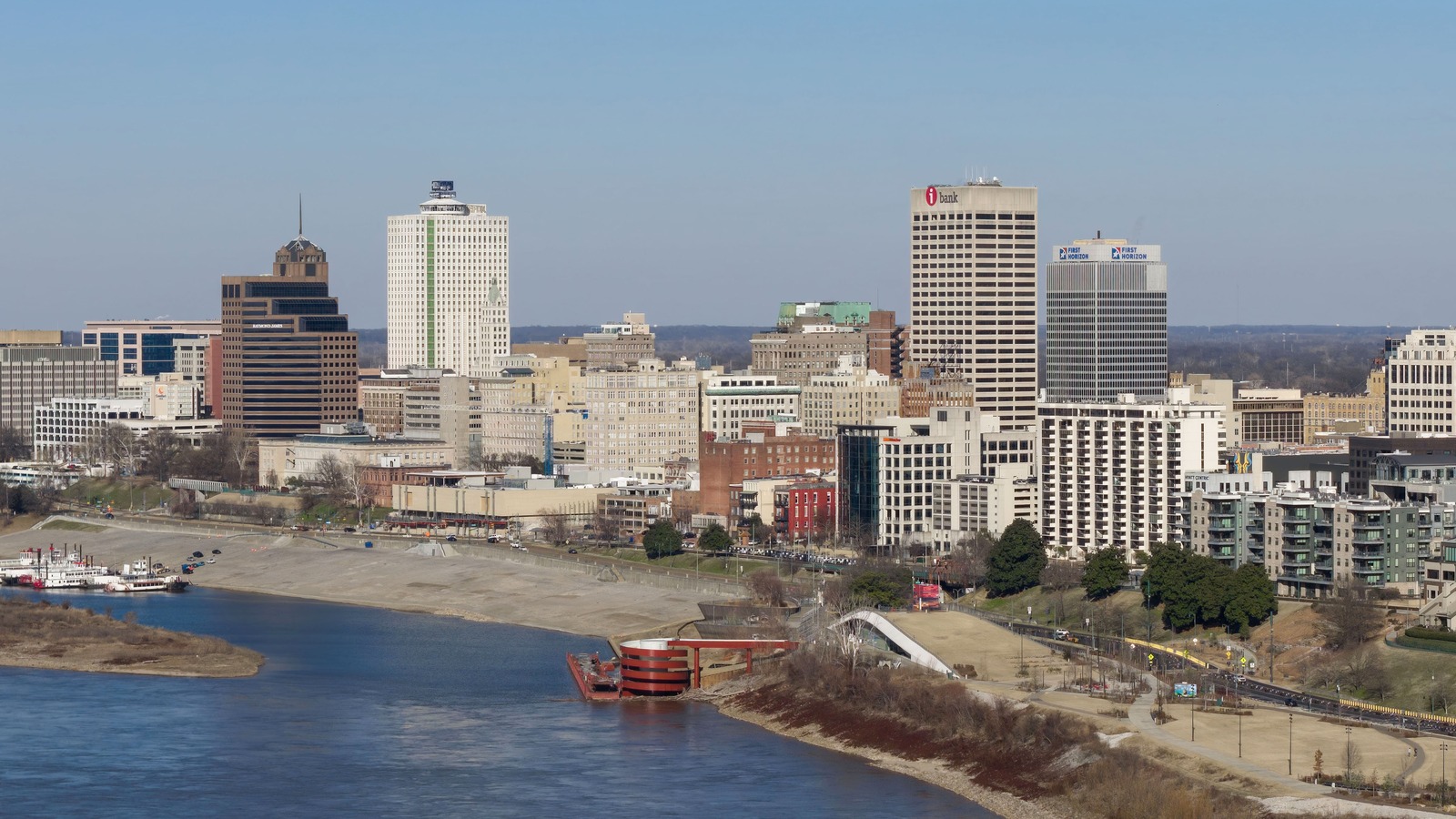 Daytime skyline of Memphis, Tennessee, along the Mississippi River with the Hernando de Soto Bridge at left