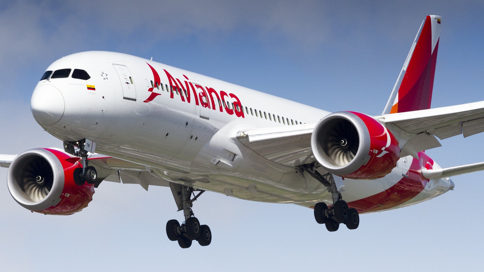 Avianca Boeing 787-8 airliner with red Avianca titles climbing after takeoff