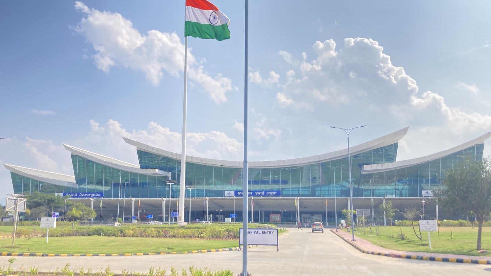 Tirupati Airport arrival entry with Indian flag and terminal facade