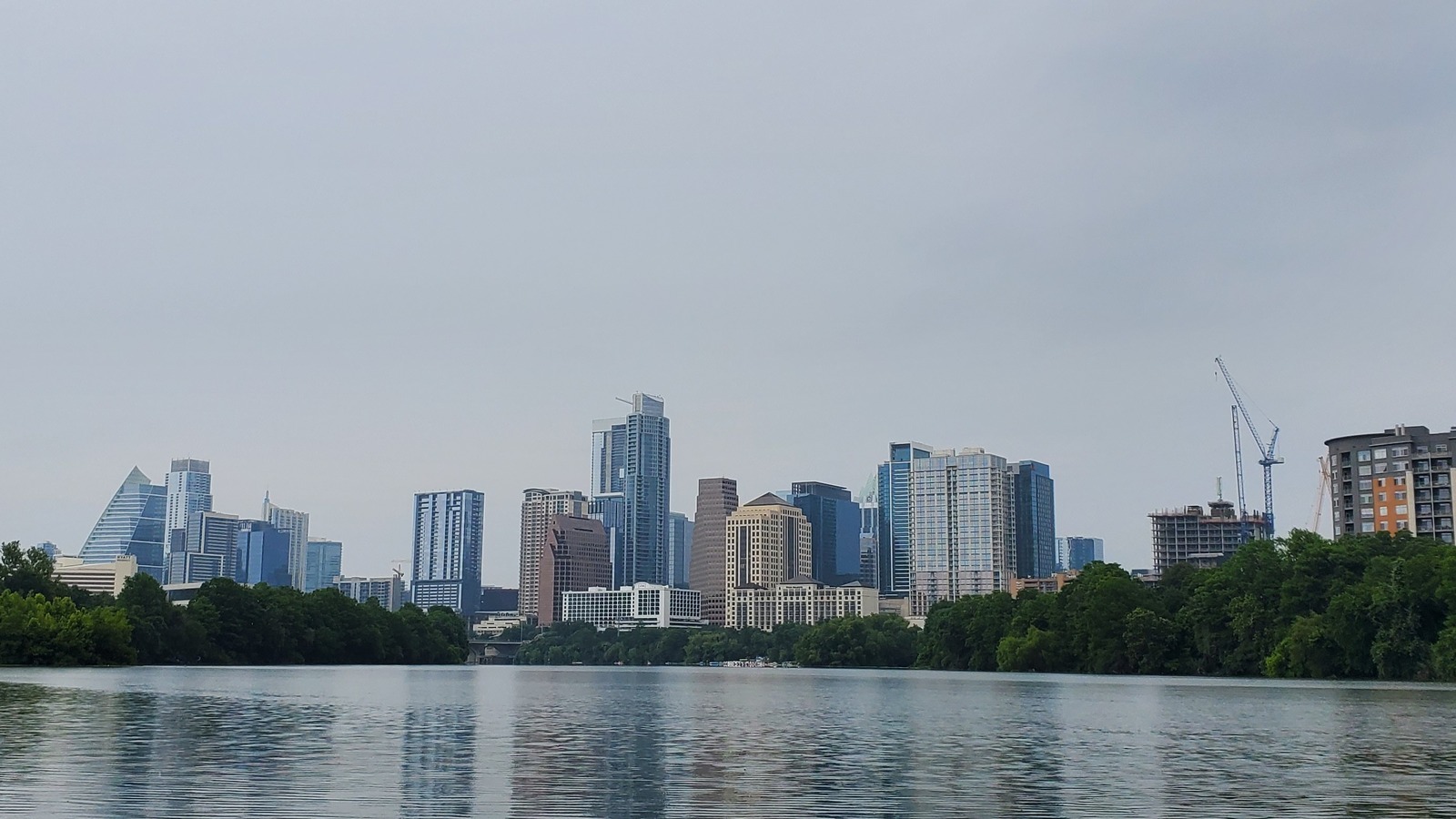 Austin Texas skyline viewed from the east, the outlook Higher Spirits markets for Boheme Hotel