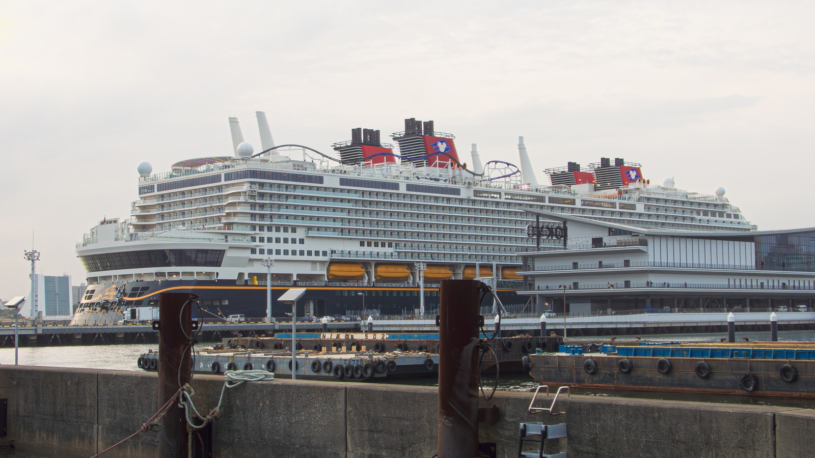 Disney Adventure cruise ship at sea under clear sky with Mickey funnel visible