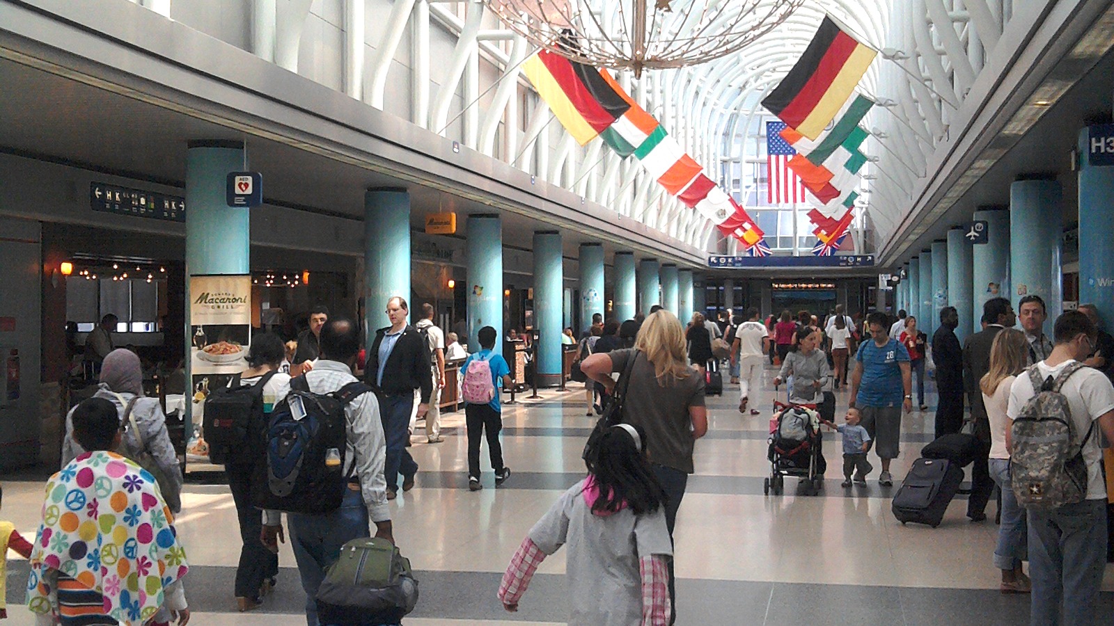 Passengers walking inside Chicago O'Hare Terminal 3