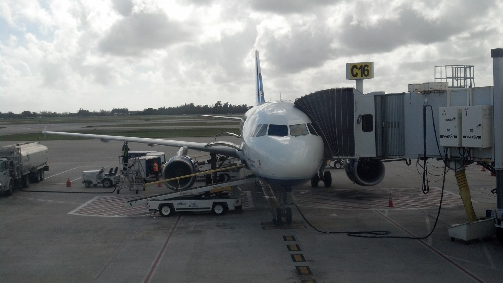 Aircraft on the ramp at Jacksonville International Airport with terminal buildings in the background
