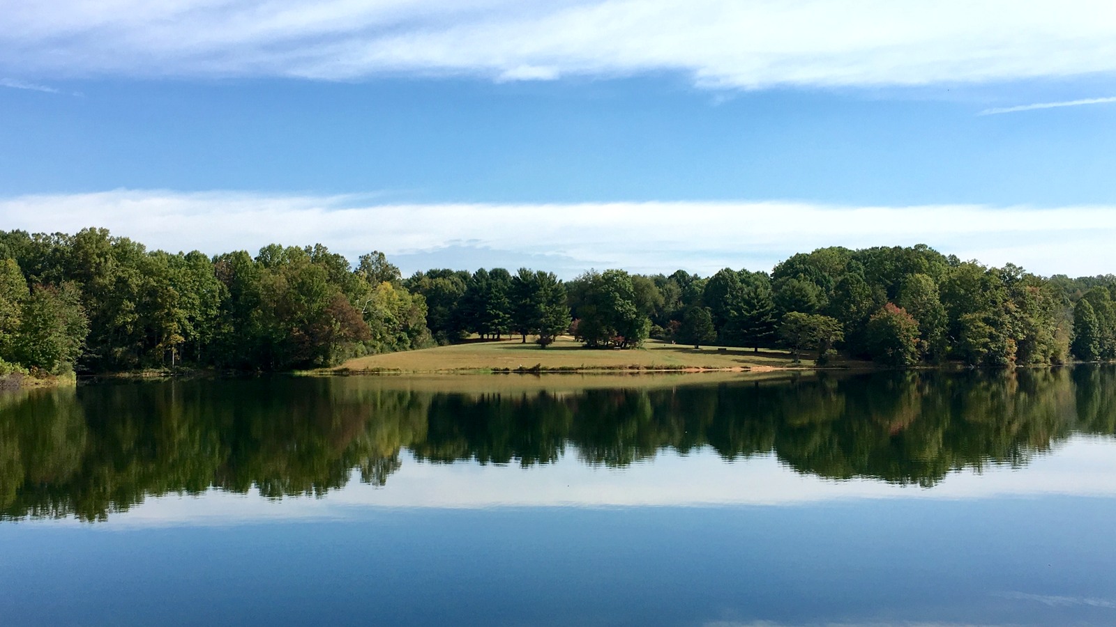 Clopper Lake at Seneca Creek State Park in Maryland on a clear day, the still-open Lake Area side of the park