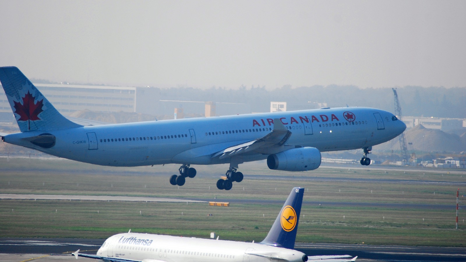 Air Canada Airbus A330 C-GHKW rotating from the runway with gear still down