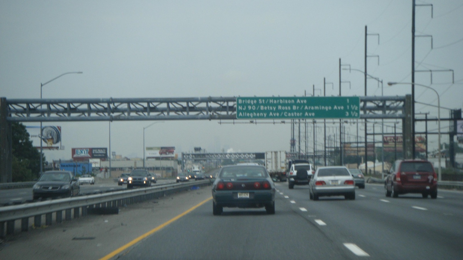 Interstate 95 overhead sign for Bridge Street and Harbison Avenue in Philadelphia