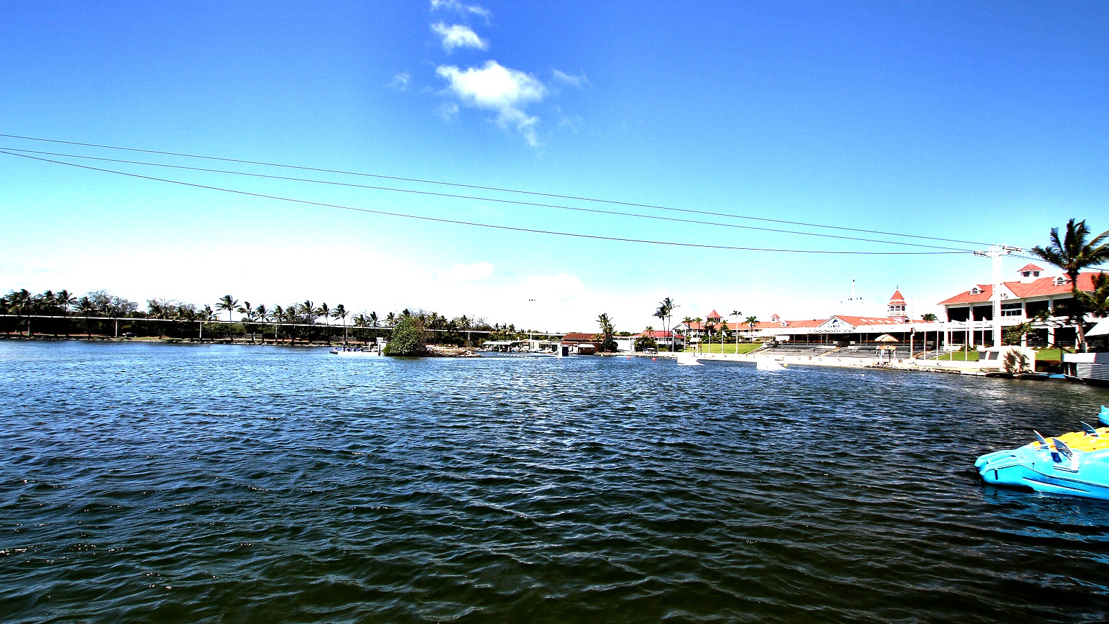 Sea World Gold Coast lake with water ski jump ramp and park buildings across the water