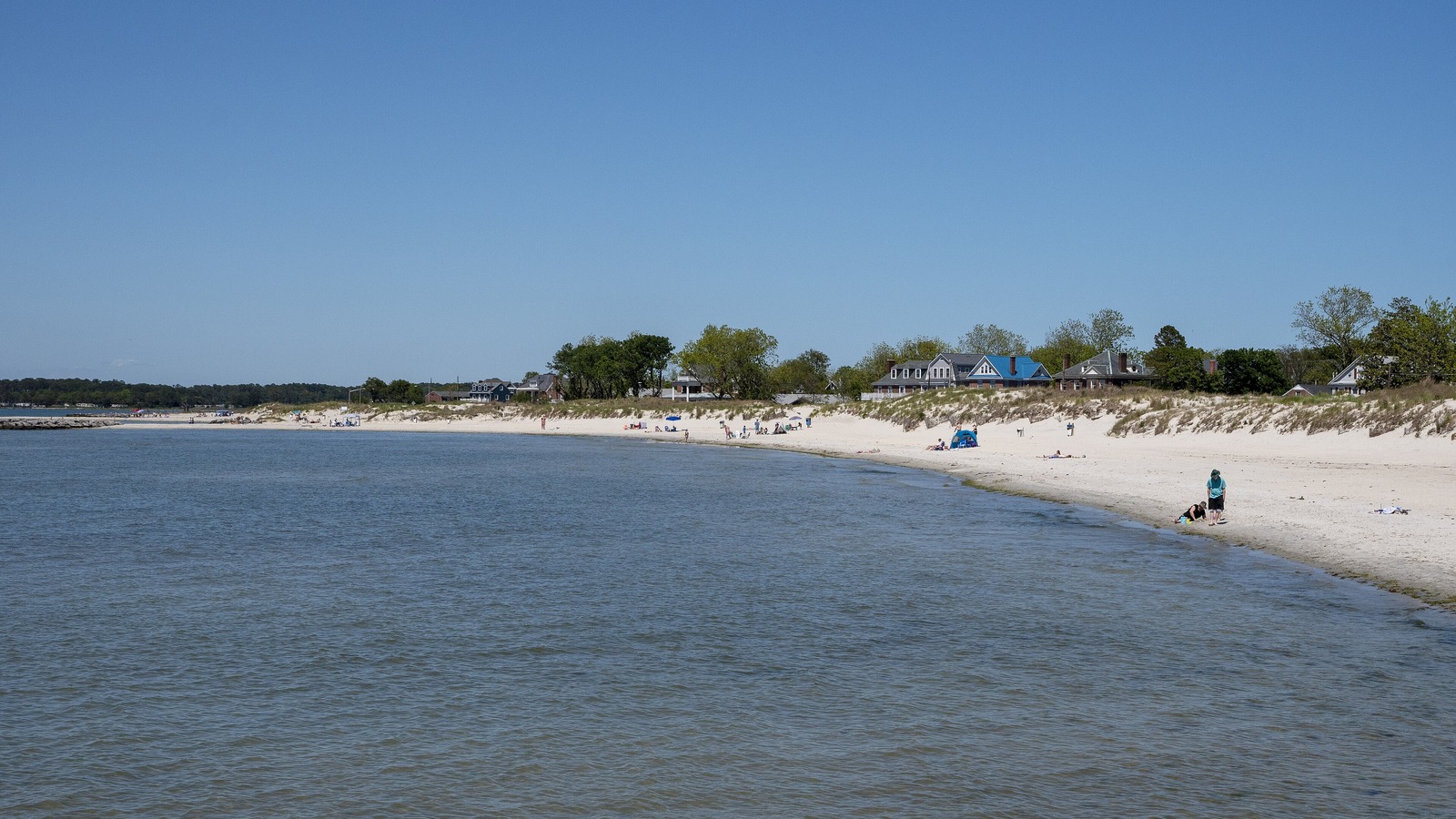 Cape Charles public beach curving along the Chesapeake Bay with houses on the dune line